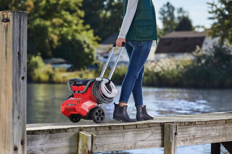 CRAFTSMAN 1500 PSI Pressure Washer being wheeled on pier by female