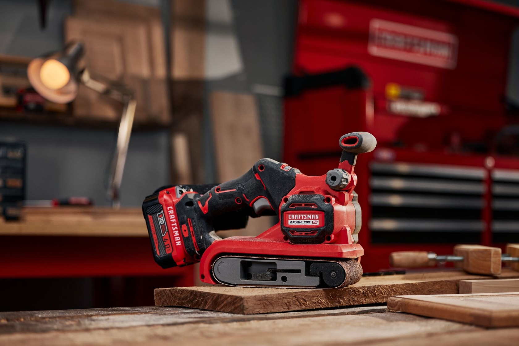 Craftsman Brushless RP Belt Sander resting on wood  