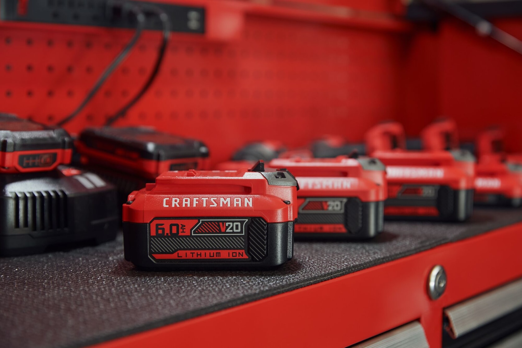 6 amp hour battery sitting on CRAFTSMAN storage