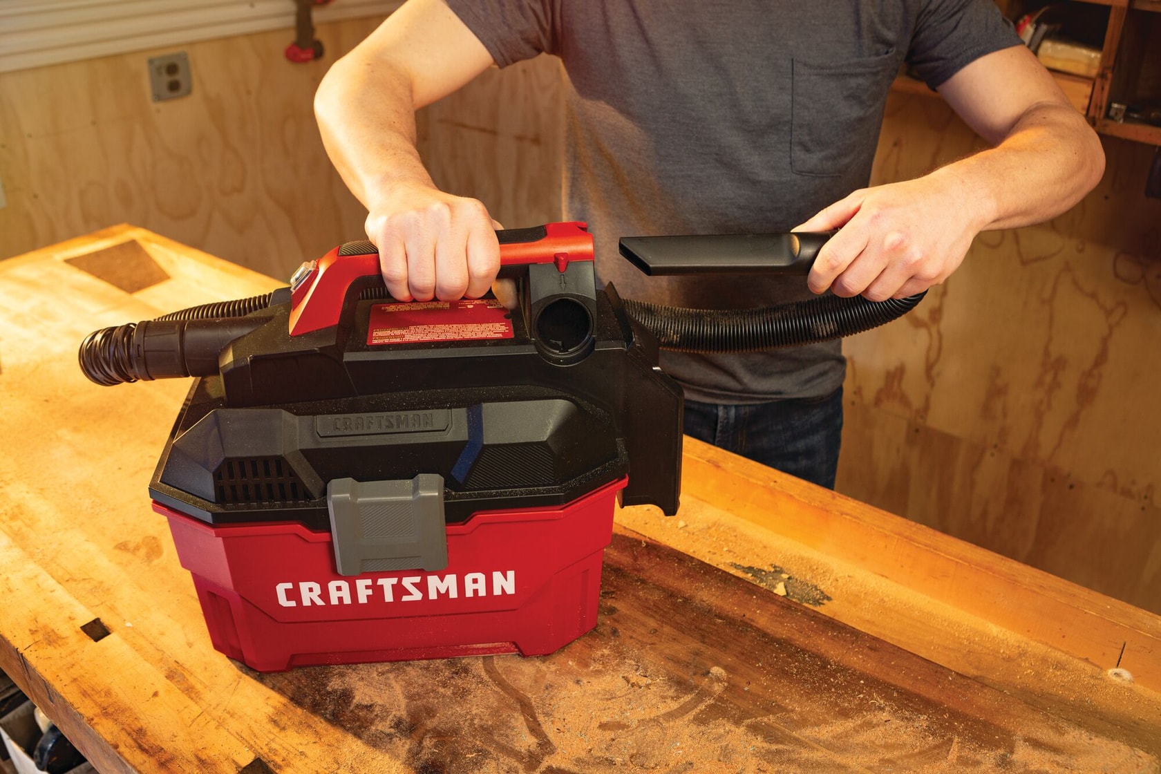 On board hose and accessory storage feature of 20 volt cordless 2 gallon wet dry vacuum.