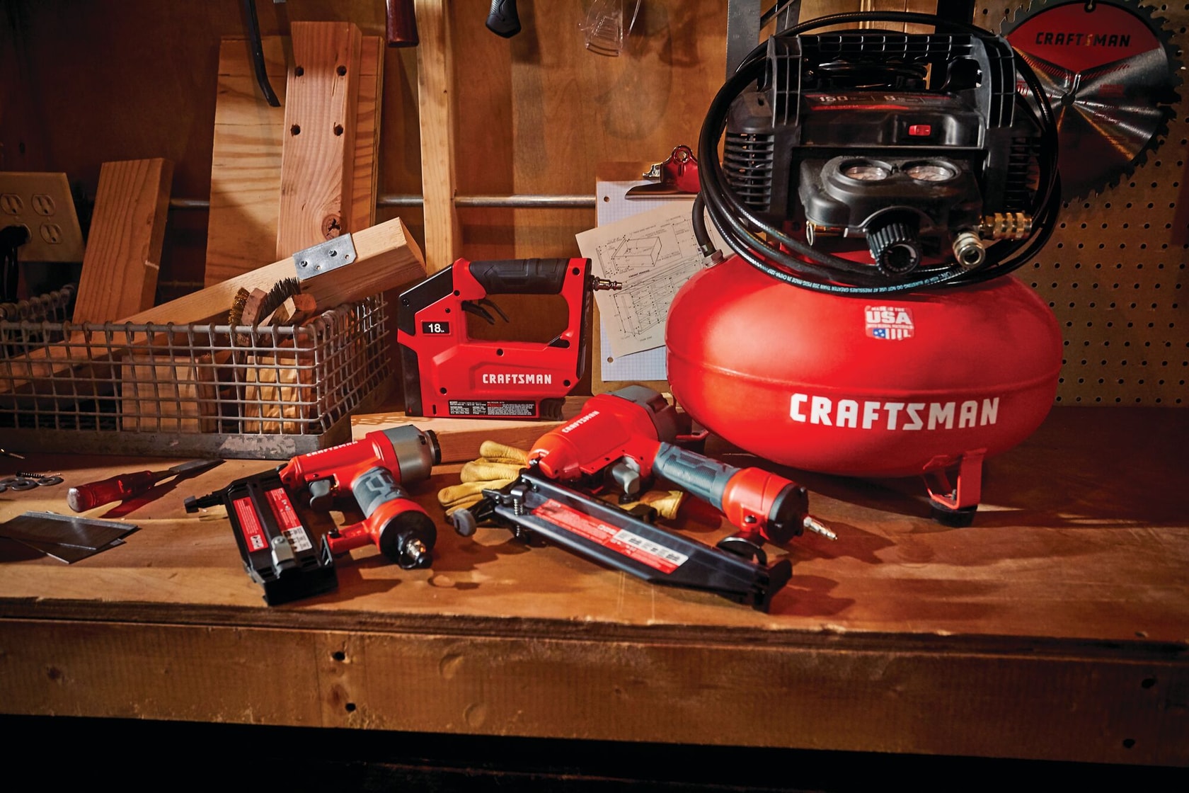 3 tools and compressor combo kit at a work place.
