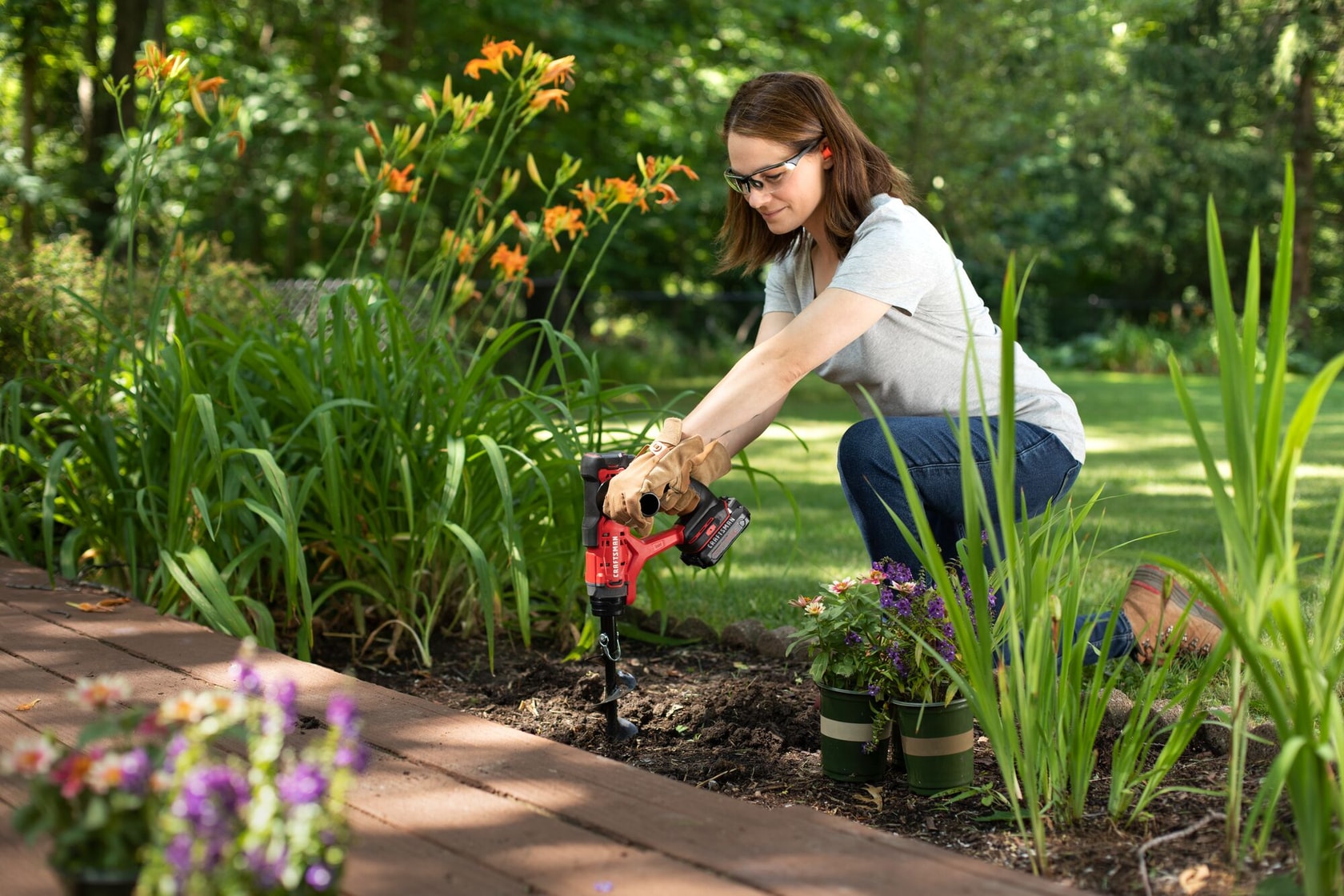 CRAFTSMAN V20* Multi-Use Garden Tool drilling hole in flowerbed for flower placement