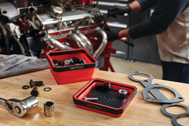 2 piece collapsible magnetic tray placed on a table.