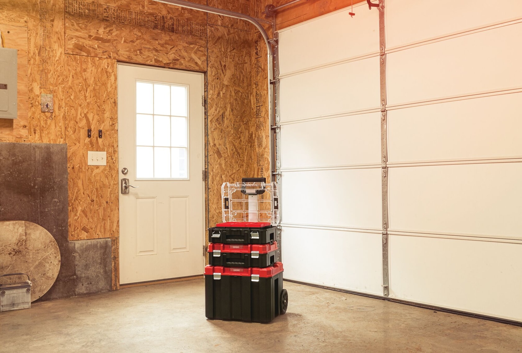 VersaStack System Tower with lid of top organizer open placed on floor of a room.